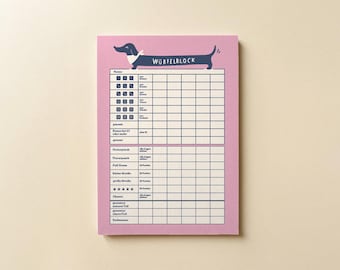 May include: A pink score pad for a dice game featuring a dark blue dachshund illustration at the top with the text WÜRFELBLOCK. The pad includes a grid for tracking game scores with columns for names and rows for various dice combinations.