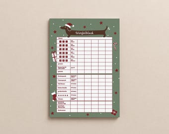 May include: A green score pad for a dice game featuring a brown dachshund wearing a Santa hat at the top with the text Würfelblock. The sheet includes a grid for tracking scores, decorated with red stars, gift boxes, and a candy cane pattern.
