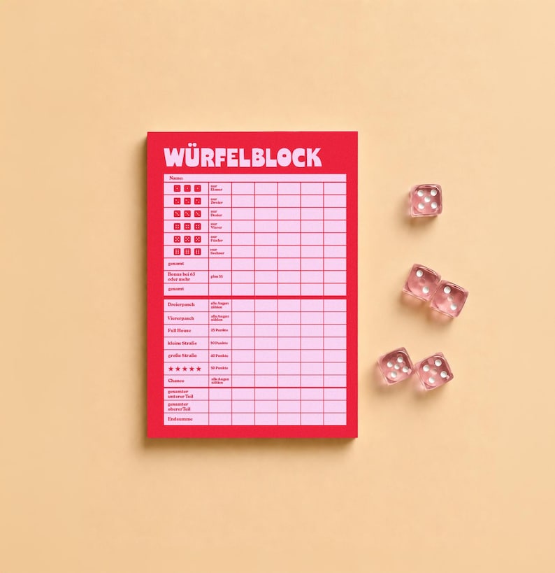 May include: A red score pad with the text W&Uuml;RFELBLOCK at the top, featuring a grid for tracking dice game results, accompanied by four translucent pink six-sided dice positioned to the right of the paper pad on a solid light tan surface.