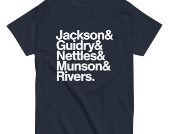 May include: A navy blue t-shirt with white text that reads "Jackson & Guidry & Nettles & Munson & Rivers."