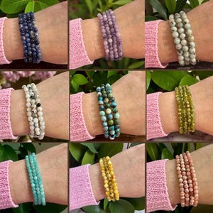 May include: Nine different gemstone bracelets, each with a unique color and bead size. Colors include blue, purple, white, green, turquoise, yellow, and pink. The bracelets are worn on wrists, showcasing the variety of styles and colors.