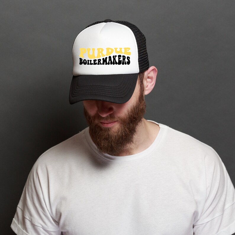 Caucasian male wearing a black and white Purdue Boilermakers trucker hat showcasing the SVG design available for instant download.
