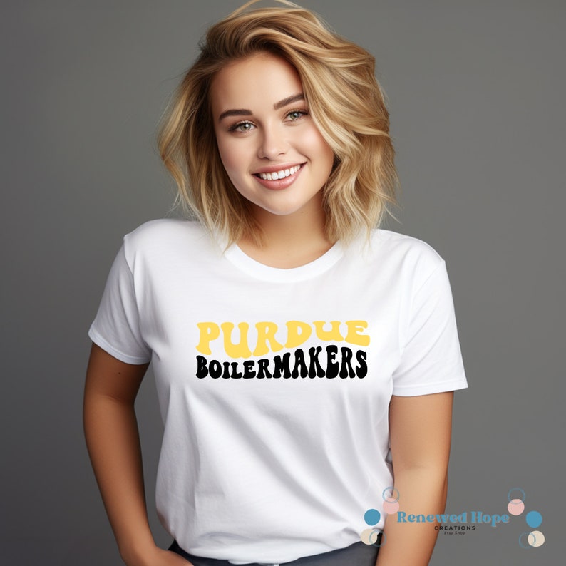 Caucasian female wearing a stylish Purdue Boilermaker white t-shirt, showcasing the SVG design available for instant download.