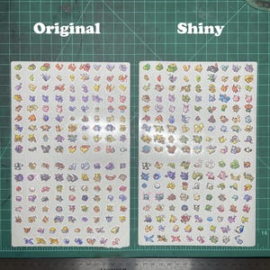 May include: Two sheets of stickers, labeled "Original" and "Shiny", are covered in colorful cartoon character designs. The stickers are on a white background, and the sheets are placed on a green cutting mat. The word "Original" is printed in white.