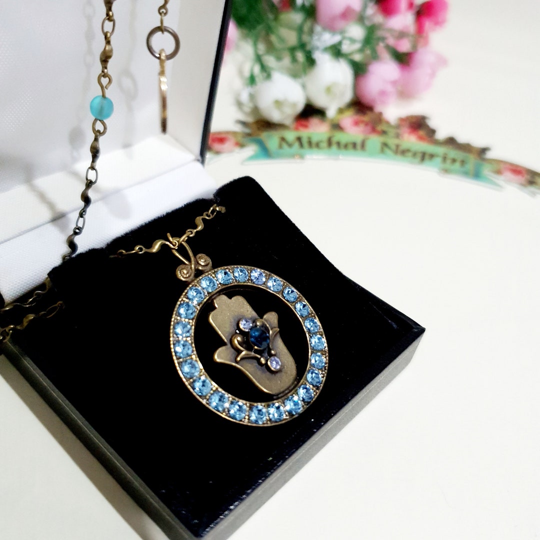 Vintage Michal Negrin Hamsa Necklace: Bronze Ring, Blue Crystal