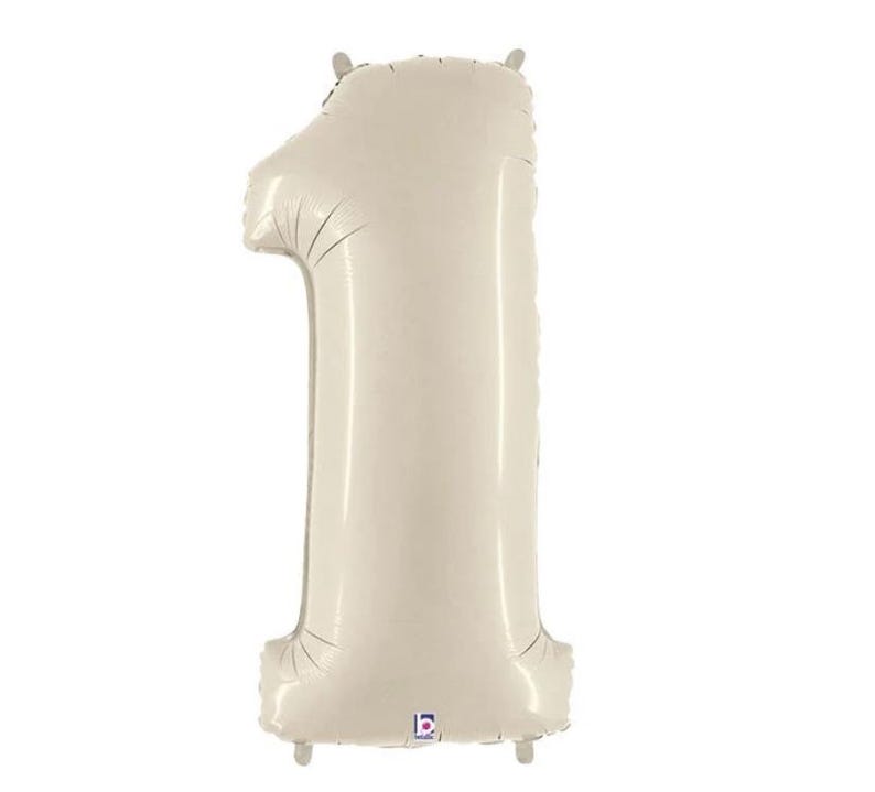 May include: A large, cream-colored number one balloon. The balloon is inflated and has a shiny, metallic finish. It is designed for birthday celebrations or other milestone events.