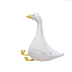 May include: A white goose-shaped balloon with a yellow beak and feet. The balloon has a curved neck and a rounded body, with a simple wing outline. The balloon is designed to stand upright.