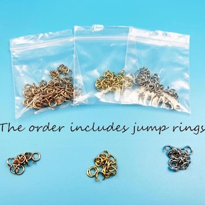 May include: Three small bags filled with gold, silver, and bronze jump rings. The order includes jump rings.