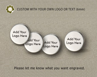 May include: Three silver round metal discs with the text "Add Your Logo Here" engraved on each.  CUSTOM WITH YOUR OWN LOGO OR TEXT (6mm) is written above the discs.  Please let me know what you want engraved.