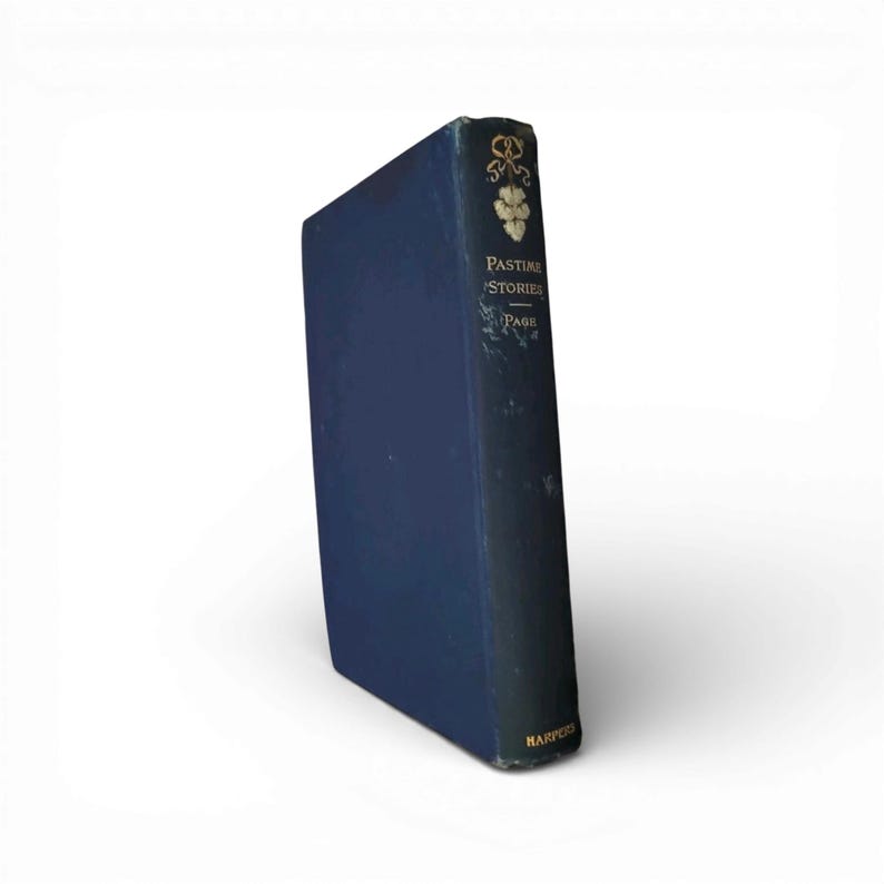 May include: A vintage hardcover book titled "Pastime Stories" by Page. The book has a dark blue cover with gold lettering and a floral design. The spine shows the title and author, with the publisher's name at the bottom. The book is in good condition.