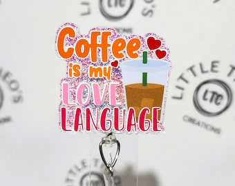 May include: A pink and orange glitter badge holder with a coffee cup and the text "Coffee is my love language".