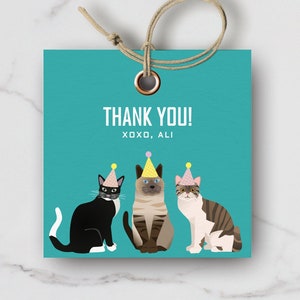 May include: Printable thank you tag featuring three cats wearing party hats. The tag is turquoise blue with white text that reads "Thank You! XOXO, ALI".