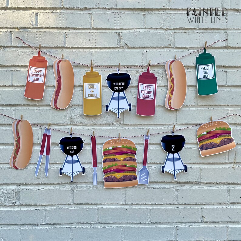 May include: A red, white, and blue birthday banner with a barbecue theme. The banner includes images of hot dogs, hamburgers, grills, ketchup, mustard, and relish. The banner also includes the text "Happy Birthday Kai", "Grill 'n' Chill", "Woo Hoo! Kai is 21", "Let's Ketchup Dude!" and "Relish the Day!"
