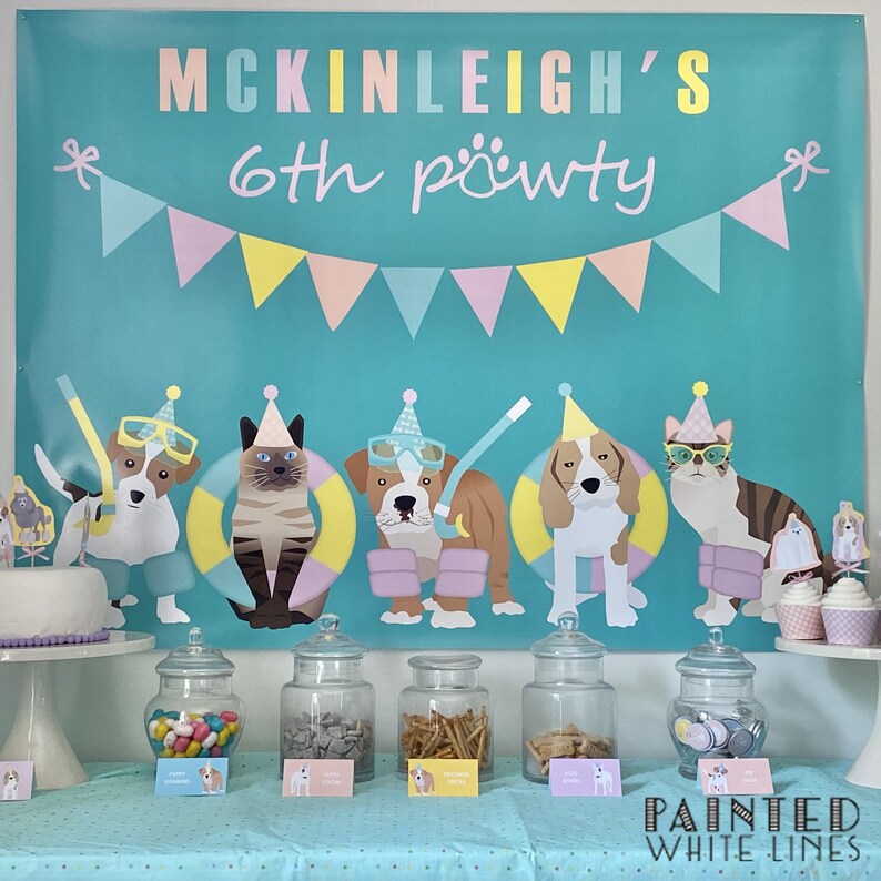 May include: A turquoise blue banner with a pink, yellow and white bunting across the top. The banner says "McKinleigh's 6th pawty". There are six cartoon animals on the banner, including a cat, a bulldog and a beagle. The animals are wearing party hats and sunglasses. Below the banner is a table with six glass jars filled with sweets, biscuits and other treats. The table is covered in a light blue tablecloth with white polka dots.