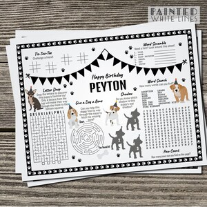 May include: A black and white printable activity sheet for a birthday party with a dog theme. The sheet includes a word search, word scramble, tic-tac-toe, letter drop, shadow matching, and a maze. The sheet is decorated with paw prints and a birthday banner. The name Peyton is written at the top of the sheet.