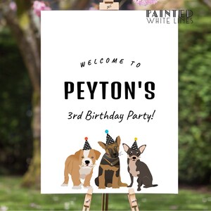 May include: Welcome to Peyton's 3rd Birthday Party! A white sign with black text and three cartoon dogs wearing party hats. The dogs are a bulldog, a German Shepherd, and a chihuahua.