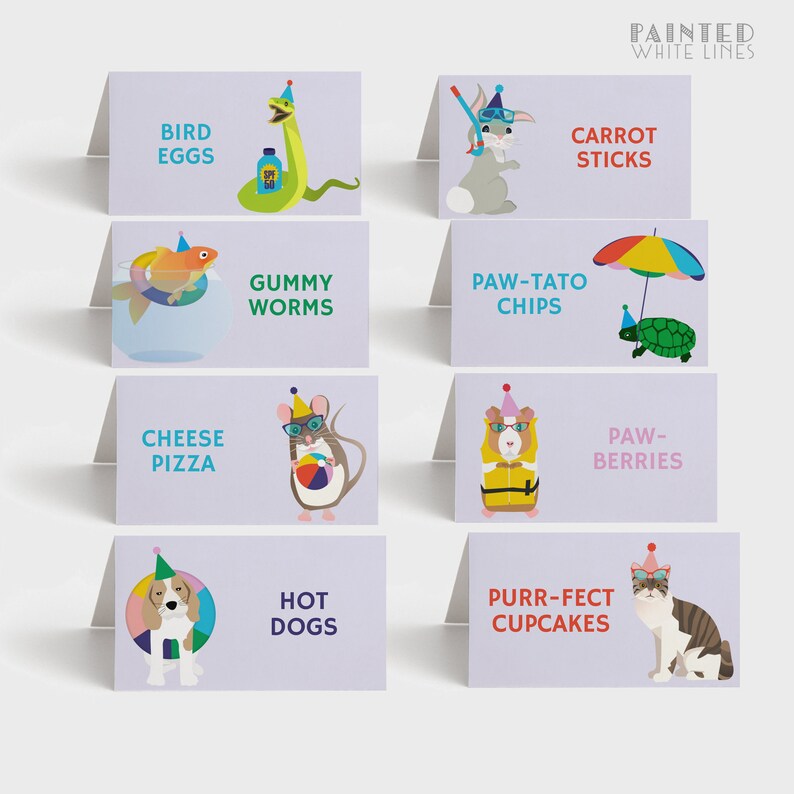 May include: Eight colorful place cards with animal illustrations and food names. The cards feature a turtle, a snake, a fish, a mouse, a guinea pig, a dog, a cat, and a rabbit. The food names are: Bird Eggs, Carrot Sticks, Gummy Worms, Paw-Tato Chips, Paw-Berries, Hot Dogs, Purr-fect Cupcakes, and Cheese Pizza.
