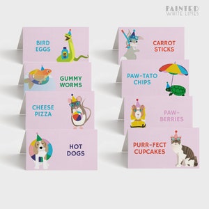 May include: Pink food labels with animal illustrations and text. The labels read: Bird Eggs, Carrot Sticks, Gummy Worms, Paw-Tato Chips, Cheese Pizza, Paw-Berries, Hot Dogs, Purr-fect Cupcakes.