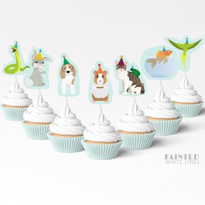 May include: Set of 7 cupcake toppers featuring various animals wearing party hats. The animals include a snake, rabbit, dog, guinea pig, cat, goldfish, and a parrot. The toppers are printed on white cardstock and have a blue background.