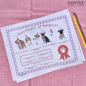 May include: A printable certificate of adoption for a puppy. The certificate has a purple border with paw prints and a red ribbon with a paw print. There are five cartoon puppies wearing party hats. The text on the certificate reads "Certificate of Adoption" and "This is to certify that... has officially adopted".