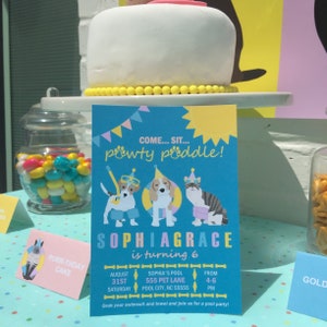 May include: A birthday party scene with a white cake, colorful candies, and a blue invitation. The invitation features cartoon dogs and a cat, with the text "pawt-y puddle!" and details for a pool party.