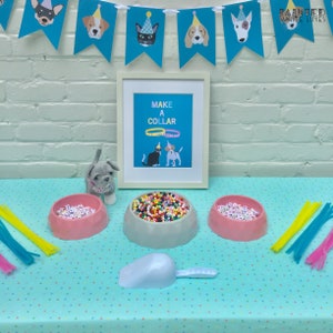 May include: A craft table set up for a dog-themed party with a sign that says "Make a Collar". There are bowls of colorful beads, pipe cleaners, and a small gray stuffed dog.