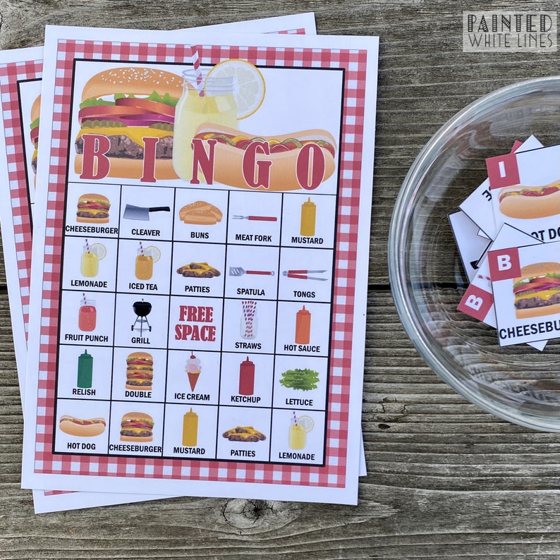 May include: A red and white checkered bingo card with a variety of food and drink items related to a barbecue or picnic. The card has the words "BINGO" at the top and "FREE SPACE" in the center. The items on the card include: cheeseburger, cleaver, buns, meat fork, mustard, lemonade, iced tea, patties, spatula, tongs, fruit punch, grill, straws, hot sauce, relish, double, ice cream, ketchup, lettuce, hot dog, cheeseburger, mustard, patties, and lemonade.