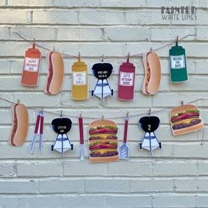 May include: A red, white, and blue birthday banner with a barbecue theme. The banner includes images of hot dogs, hamburgers, grills, ketchup, mustard, and relish. The banner also includes the text "Happy Birthday Kai", "Grill 'n' Chill", "Woo Hoo! Kai is 21", "Let's Ketchup Dude!" and "Relish the Day!"