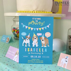May include: A blue and yellow birthday party invitation with a paw print and the text "It's time to pawty!"  Three cartoon dogs are featured with speech bubbles that say "come", "sit", and "play". The invitation is for Isabella's 8th birthday party on September 14, 2019, from 10:30 AM to 12:30 PM. The address is 555 Puppy City, Anywhere USA. RSVP to Clare at 555-555-5555.