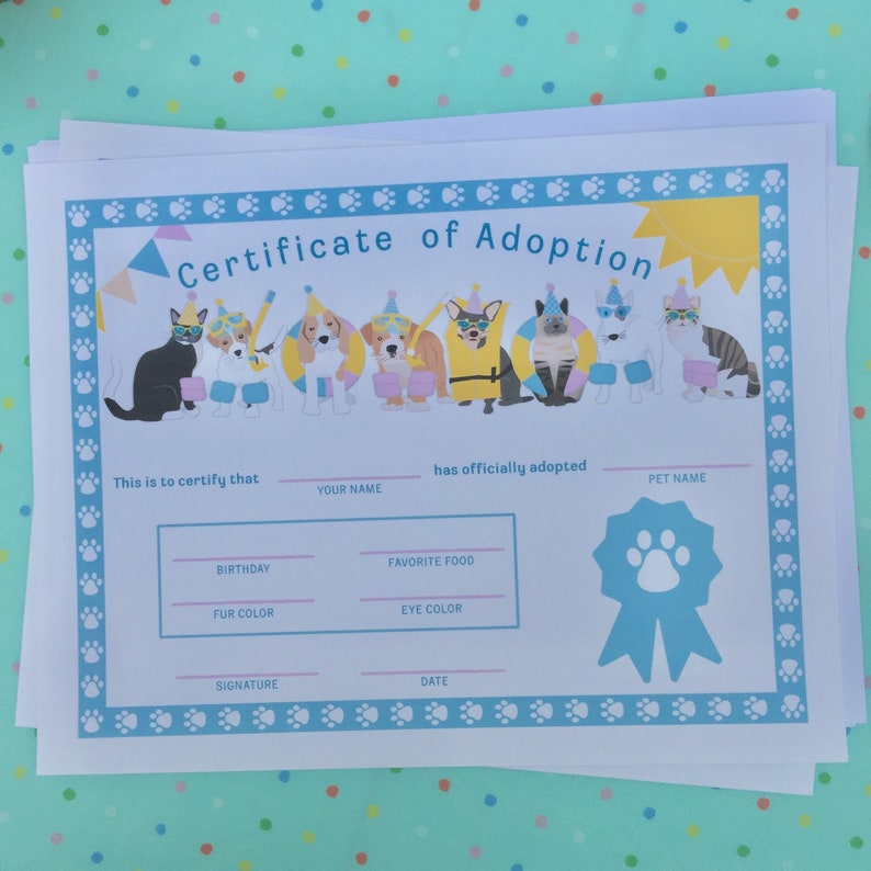 May include: A printable certificate of adoption for a pet. The certificate has a blue border with paw prints and a yellow sun. There are illustrations of cats and dogs wearing party hats and sunglasses. The text reads "Certificate of Adoption".