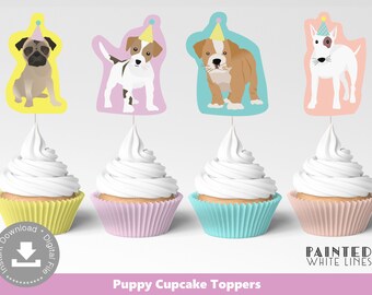 May include: Set of four cupcakes with white frosting and colorful paper liners. Each cupcake is topped with a puppy-shaped cutout wearing a party hat. The toppers feature a pug, a Jack Russell Terrier, a bulldog, and a white dog. The text "Puppy Cupcake Toppers" is at the bottom.