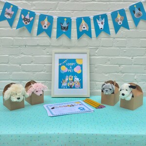 May include: A table covered in a turquoise tablecloth with white polka dots. There are four brown boxes with stuffed animals peeking out of the top. A sign that says "Adopt a Pet" is on the table with a blue and yellow banner behind it.