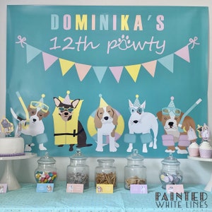May include: A turquoise banner with the text "Dominika's 12th pawty" and a string of pink, yellow, and blue flags. Five dogs wearing party hats and goggles are depicted on the banner. A table with jars of candy and snacks is set up in front of the banner. The text "Painted White Lines" is visible in the bottom right corner.
