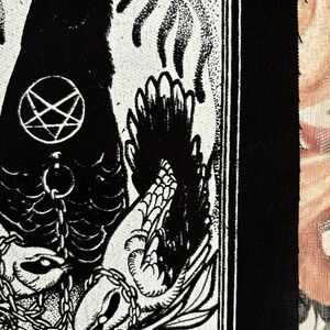 May include: Black and white illustration of a crow with a pentagram on its chest, chained to a bird with its wings spread. The image is on a white background with a black border.