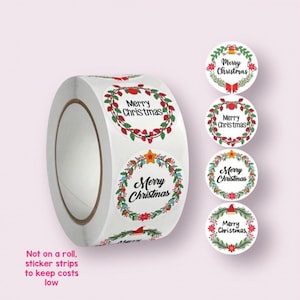 May include: Roll of round Christmas stickers with a wreath design and the text "Merry Christmas".