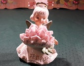 Lefton February Angel with Spaghetti Trim, Holding a Bunch of Violets, Gold Painted Wing Tips, Halo and Accents. Cute Hand Paintted Face. 4 quot