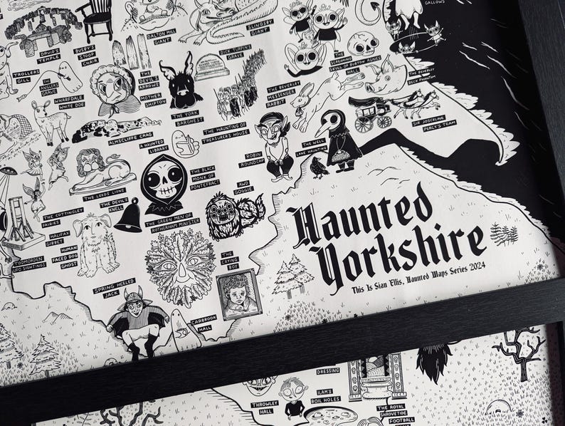 May include: A black and white illustrated map of haunted locations in Yorkshire, England. The map features various spooky creatures and landmarks, including a black cat, a ghost, a skull, and a tree with a face. The text "Haunted Yorkshire" is written in a bold, gothic font at the bottom of the map.