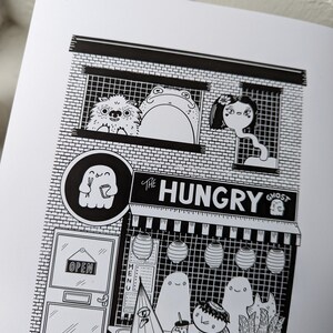 May include: Black and white illustration of a storefront called "The Hungry Ghost" with a ghost holding chopsticks and a menu board. There are three ghosts and a creature with a leafy head inside the store.