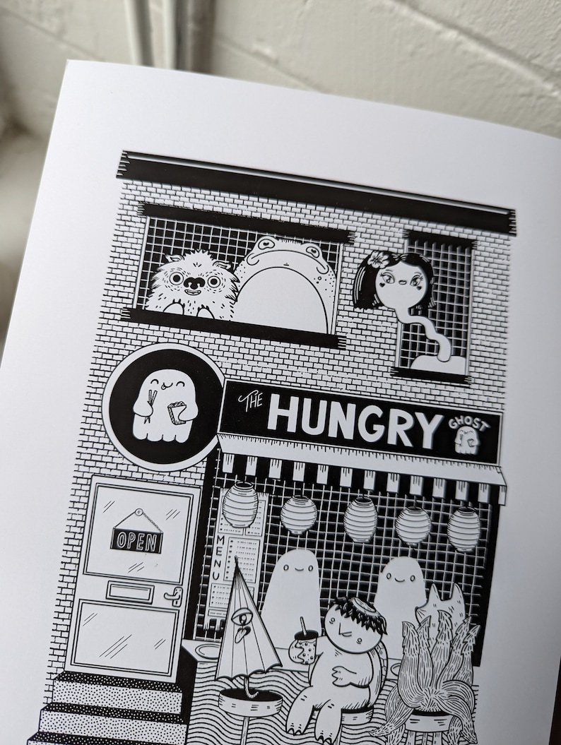 May include: Black and white illustration of a storefront called "The Hungry Ghost" with a ghost holding chopsticks and a menu board. There are three ghosts and a creature with a leafy head inside the store.