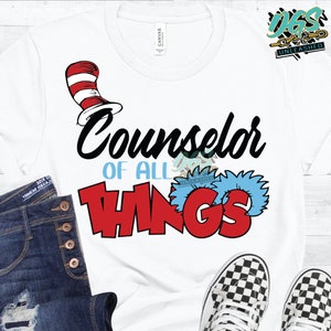 May include: White t-shirt with a black and red graphic that says "Counselor of All Things". The graphic includes a red and white striped hat with a blue and white furry tuft.