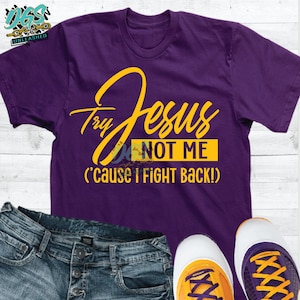 May include: Purple t-shirt with yellow text that reads "Try Jesus Not Me ('cause I fight back!)"