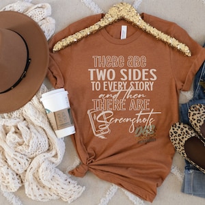 May include: A brown t-shirt with the text "There are two sides to every story and then there are screenshots" in white lettering. The shirt is on a white surface with a brown hat, a white coffee cup, and a pair of jeans with leopard print shoes.