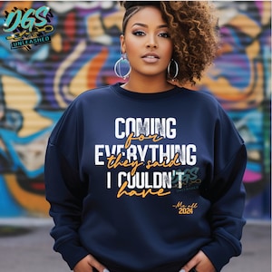 May include: A navy blue sweatshirt with the text "COMING for EVERYTHING they said I COULDN'T have -Me all 2024" in white and orange lettering.