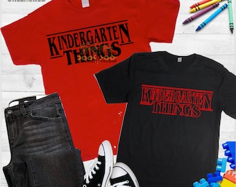 May include: Two t-shirts with the text "Kindergarten Things" in a red and black color scheme. The text is styled to look like the title card from the show "Stranger Things".