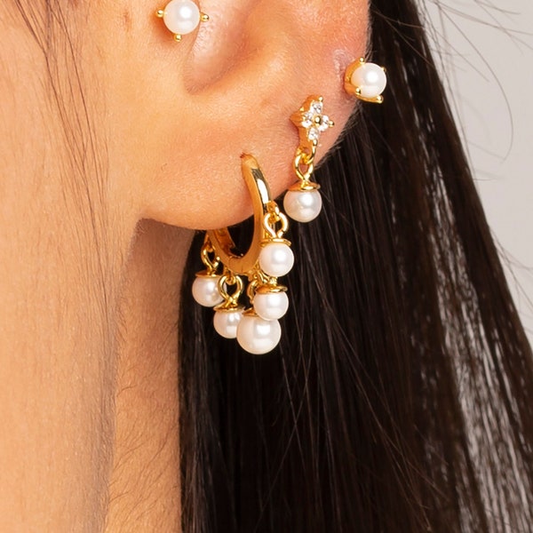 Huggie hoop earrings with five dangling natural pearls