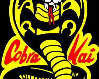 May include: Black and yellow Cobra Kai logo with a red cobra and the text "Cobra Kai" in red.