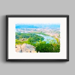 May include: A watercolor painting of a river winding through a green valley, with a city in the distance. The painting is framed in black.