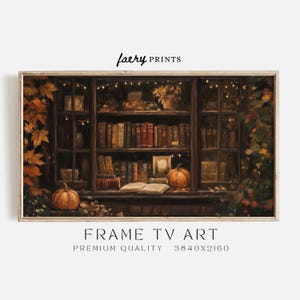 May include: A painting of a bookshelf filled with books, with a pumpkin and an open book on the shelf. The bookshelf is decorated with fairy lights and autumn leaves. The painting is in a wooden frame.