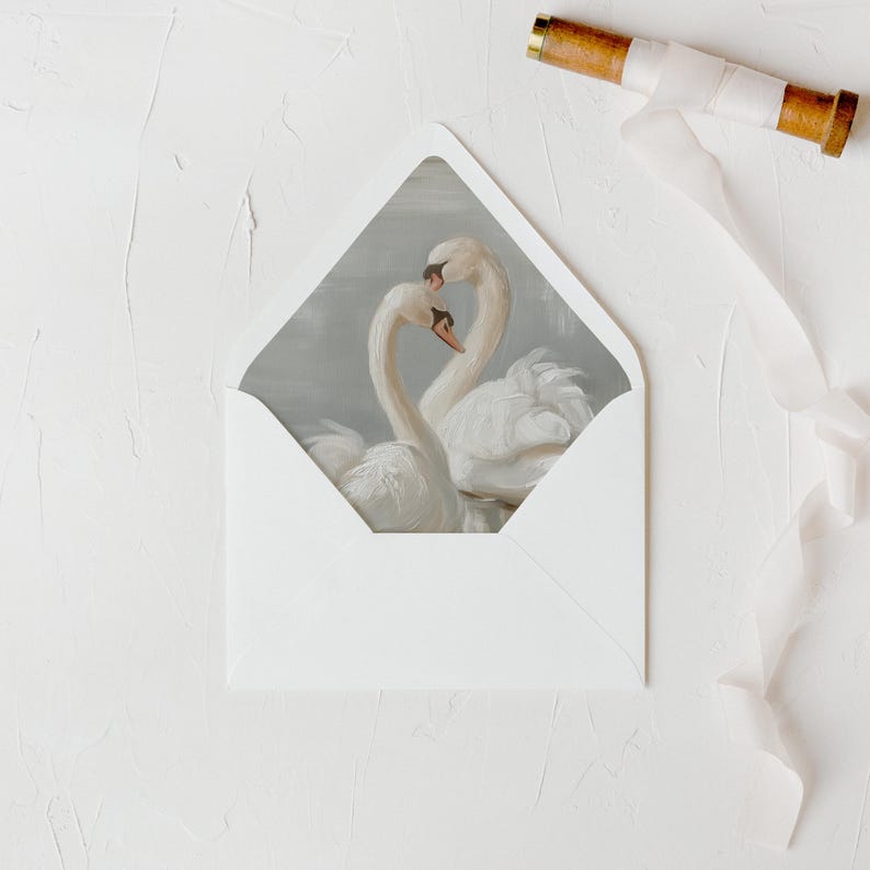 May include: A white envelope with a grey background featuring a painting of two white swans with their necks intertwined. The swans are facing each other and their beaks are touching.