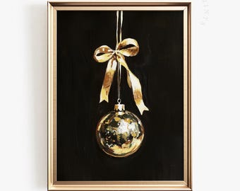 May include: A framed painting of a gold Christmas ornament with a matching bow and ribbon against a black background. The artwork is in a gold frame. The text "FAERY PRINTS" is in the upper right corner.